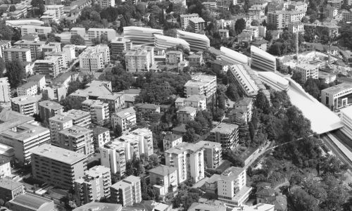 Facultades del Campus Universitario Supsi en Lugano vista aerea oeste de Diseño de conjunto integrado en la ciudad Cruz y Ortiz Arquitectos